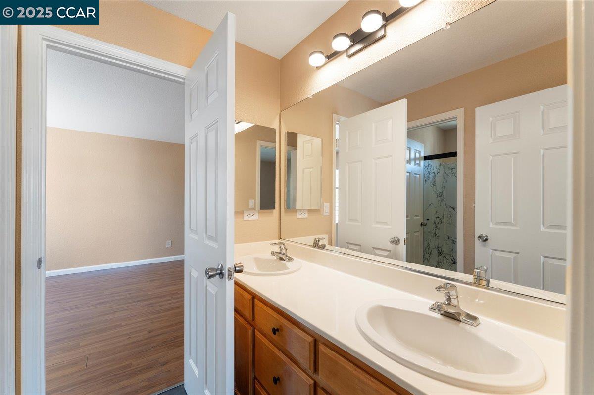 4651 Shetland Way Antioch, CA 94531 - Photo 15 of 34 a bathroom with a sink and a mirror