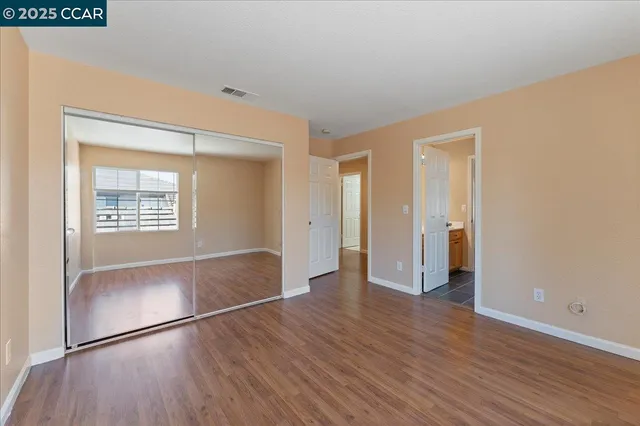 a view of livingroom with hardwood floor and hallway