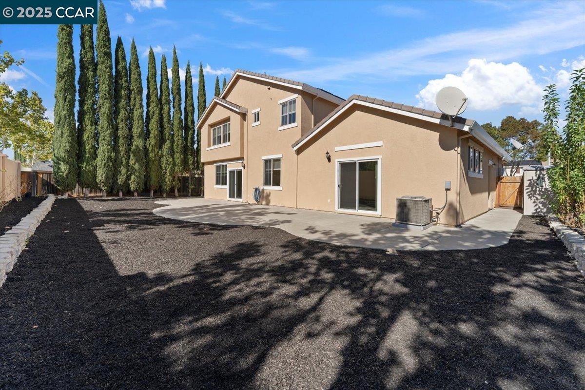 4651 Shetland Way Antioch, CA 94531 - Photo 32 of 34 a view of a white house with a yard
