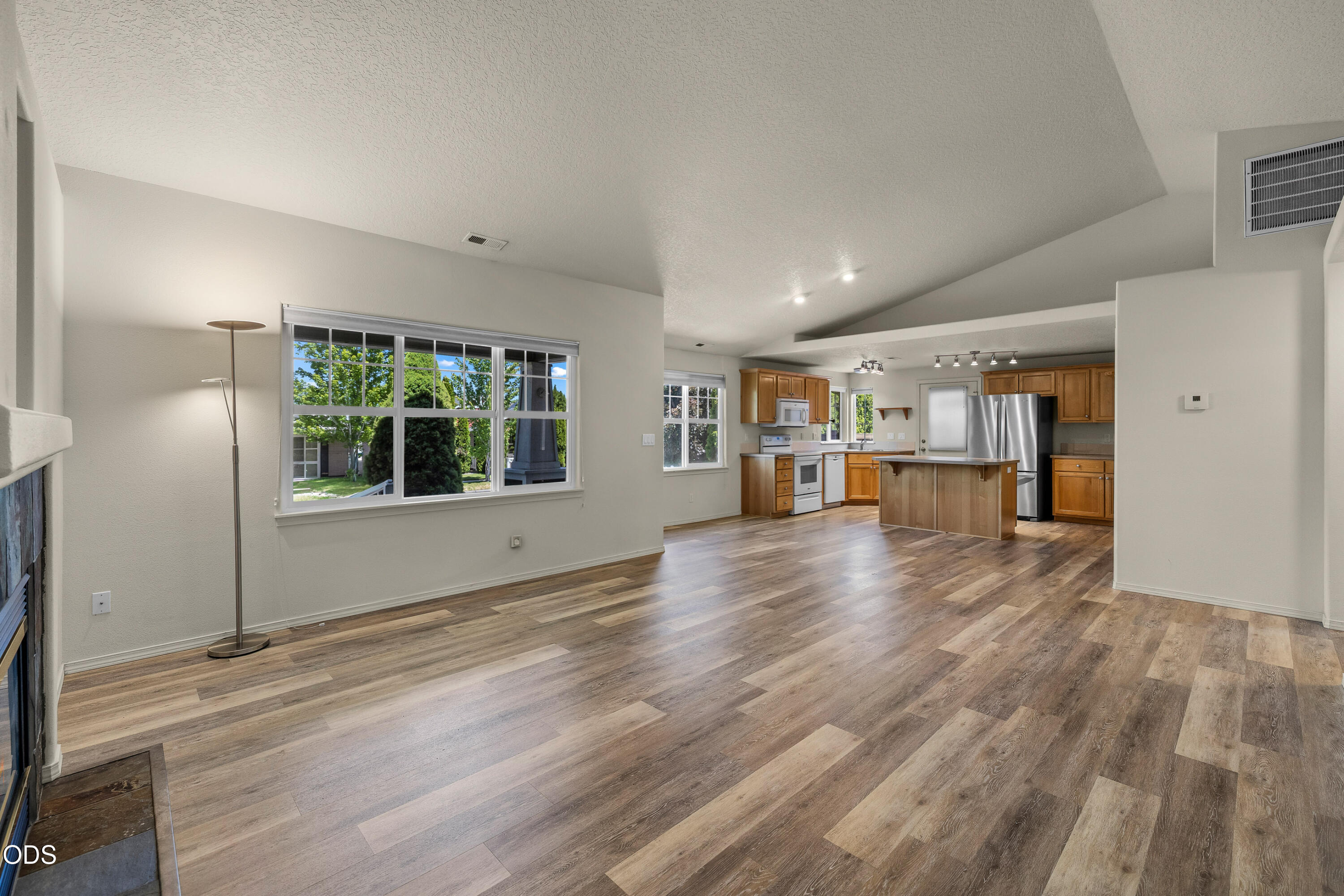 20535 Sunderland Way Bend, OR 97701 - Photo 18 of 41 a view of empty room with wooden floor and windows