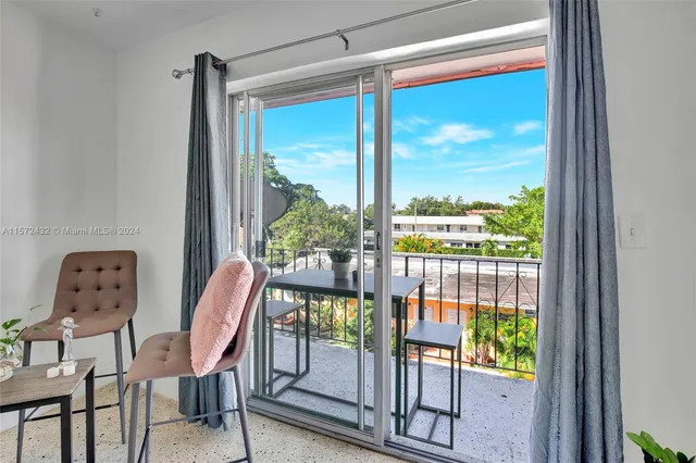 a view of a room with a furniture and windows