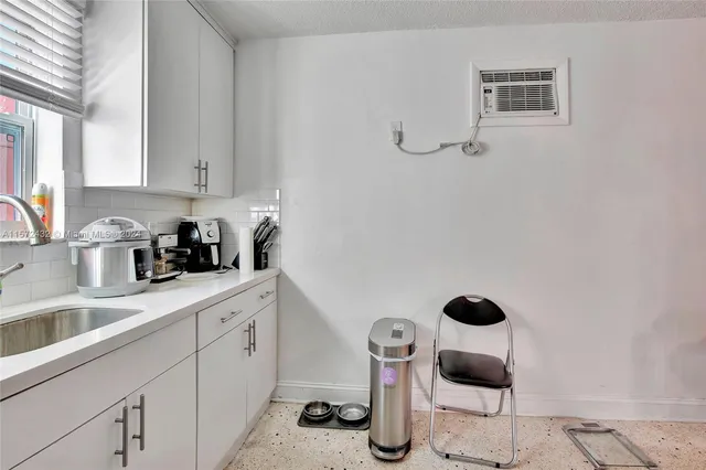 a kitchen with a sink stove and refrigerator