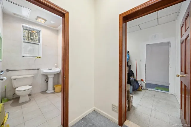 a bathroom with a toilet and a sink