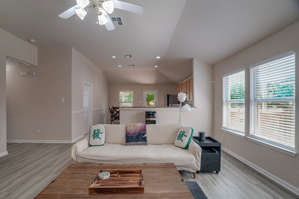2724 Kickapoo Cavern Drive Pflugerville, TX 78660 - Photo 8 of 24 Natural light floods this inviting living area, showcasing its open-concept layout.