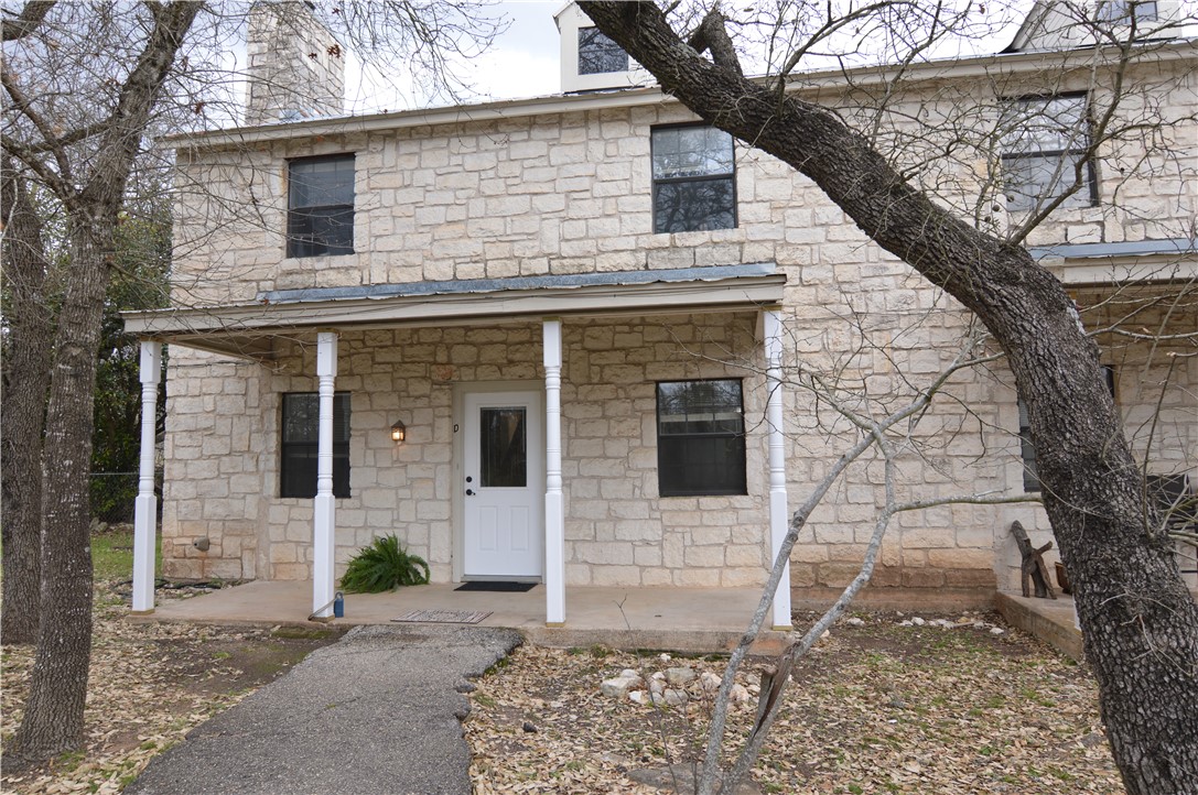8912 Circle Drive, Unit D Austin, TX 78736 - Photo 1 of 1 a front view of a house with parking space