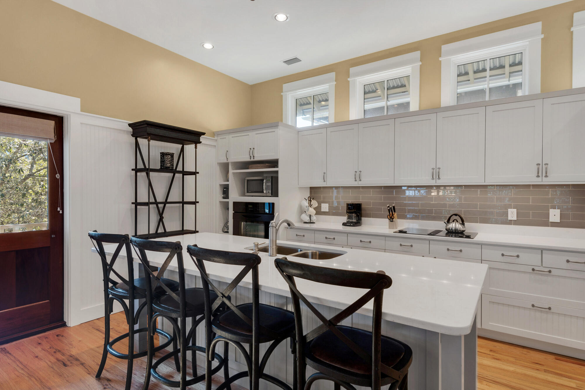 80 Round Road Rosemary Beach, FL 32461 - Photo 8 of 66 a kitchen with stainless steel appliances granite countertop a table chairs sink and cabinets