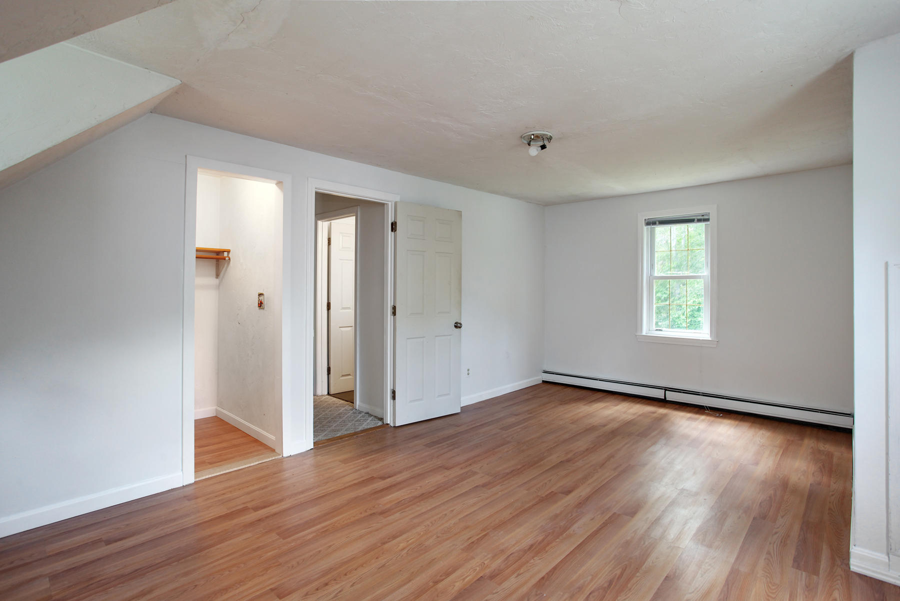 55 Edgewater Road Mashpee, MA 02649 - Photo 15 of 21 an empty room with wooden floor and windows
