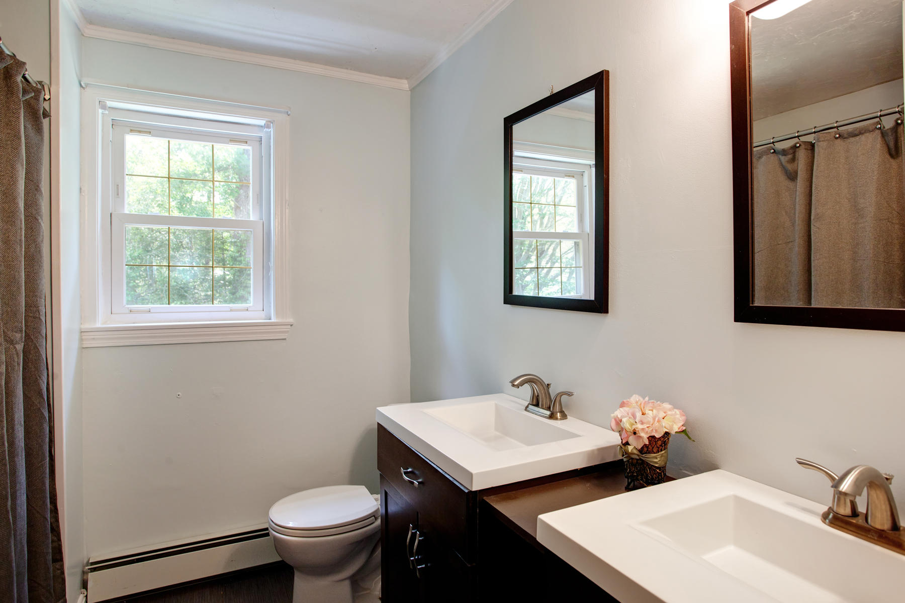 55 Edgewater Road Mashpee, MA 02649 - Photo 16 of 21 a bathroom with a toilet sink and mirror