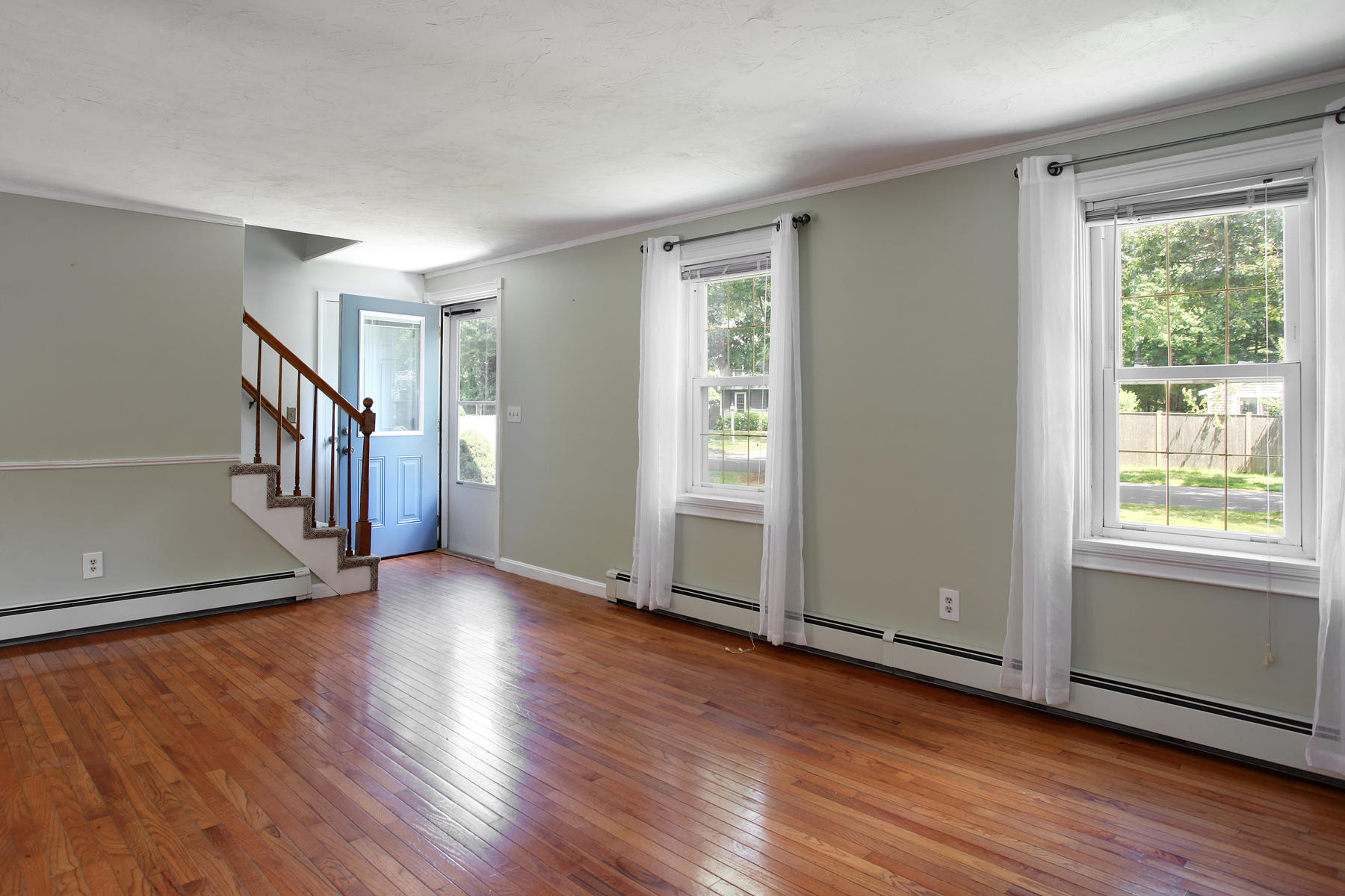 55 Edgewater Road Mashpee, MA 02649 - Photo 2 of 21 an empty room with wooden floor and windows