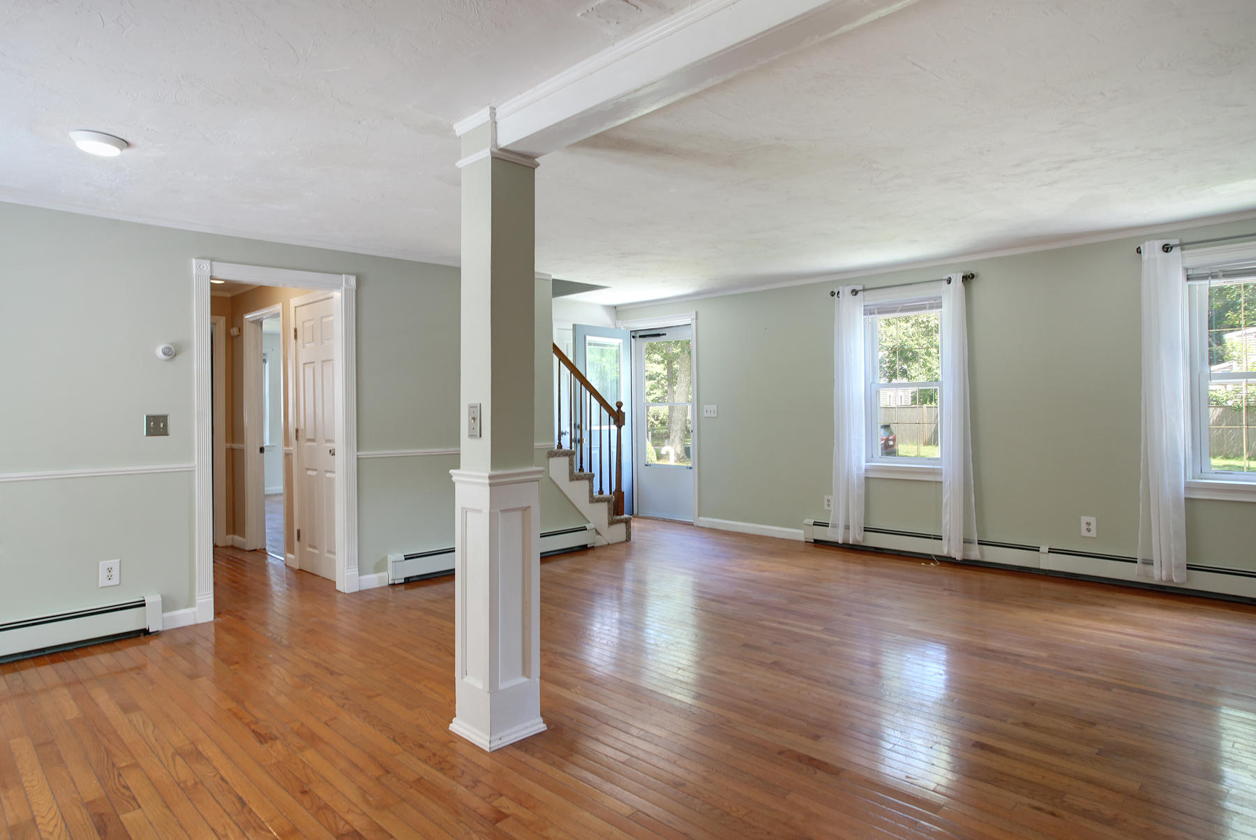 55 Edgewater Road Mashpee, MA 02649 - Photo 3 of 21 an empty room with wooden floor and windows