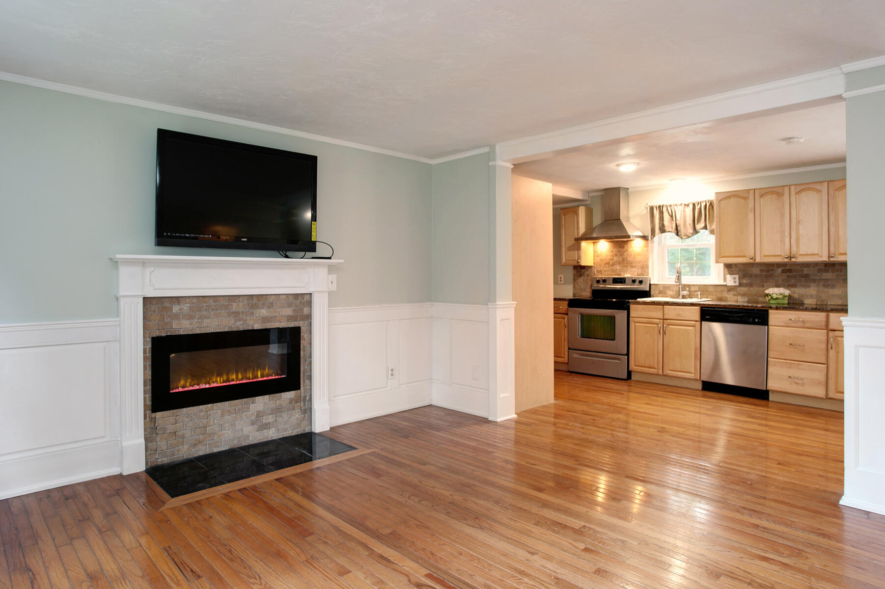 55 Edgewater Road Mashpee, MA 02649 - Photo 5 of 21 a kitchen with granite countertop a stove top oven and refrigerator