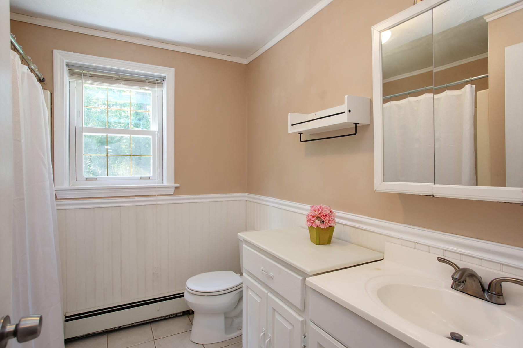 55 Edgewater Road Mashpee, MA 02649 - Photo 9 of 21 a bathroom with a sink and a vanity
