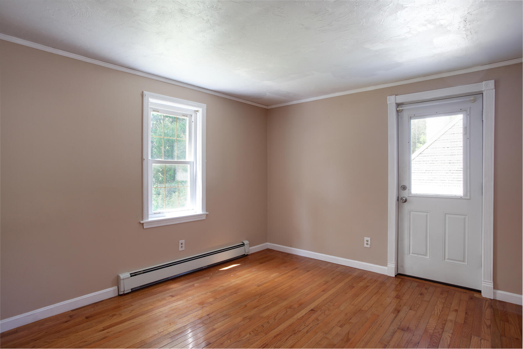 55 Edgewater Road Mashpee, MA 02649 - Photo 10 of 21 an empty room with wooden floor and windows
