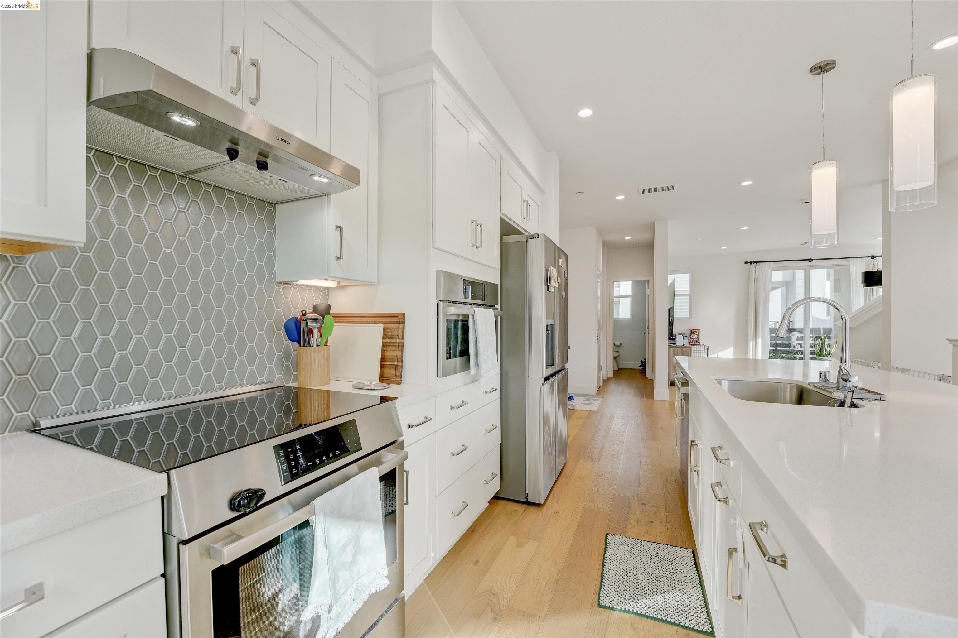 7101 Melon Court San Ramon, CA 94583 - Photo 30 of 58 a kitchen with stainless steel appliances granite countertop a sink stove and refrigerator