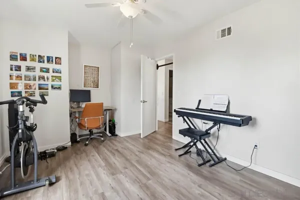 a work room with furniture and wooden floor