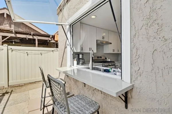 a kitchen with stainless steel appliances kitchen island granite countertop a sink and cabinets