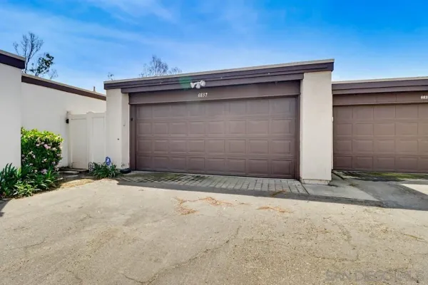 a small space area with a wooden door