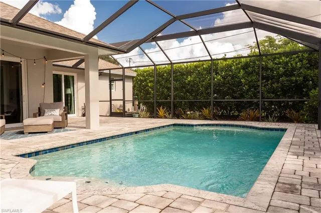 a view of a swimming pool with a patio