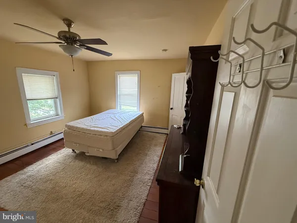 a view of a pathway with a wrought fence