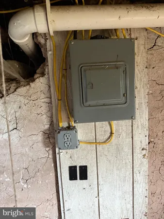 a view of a field with trees in the background