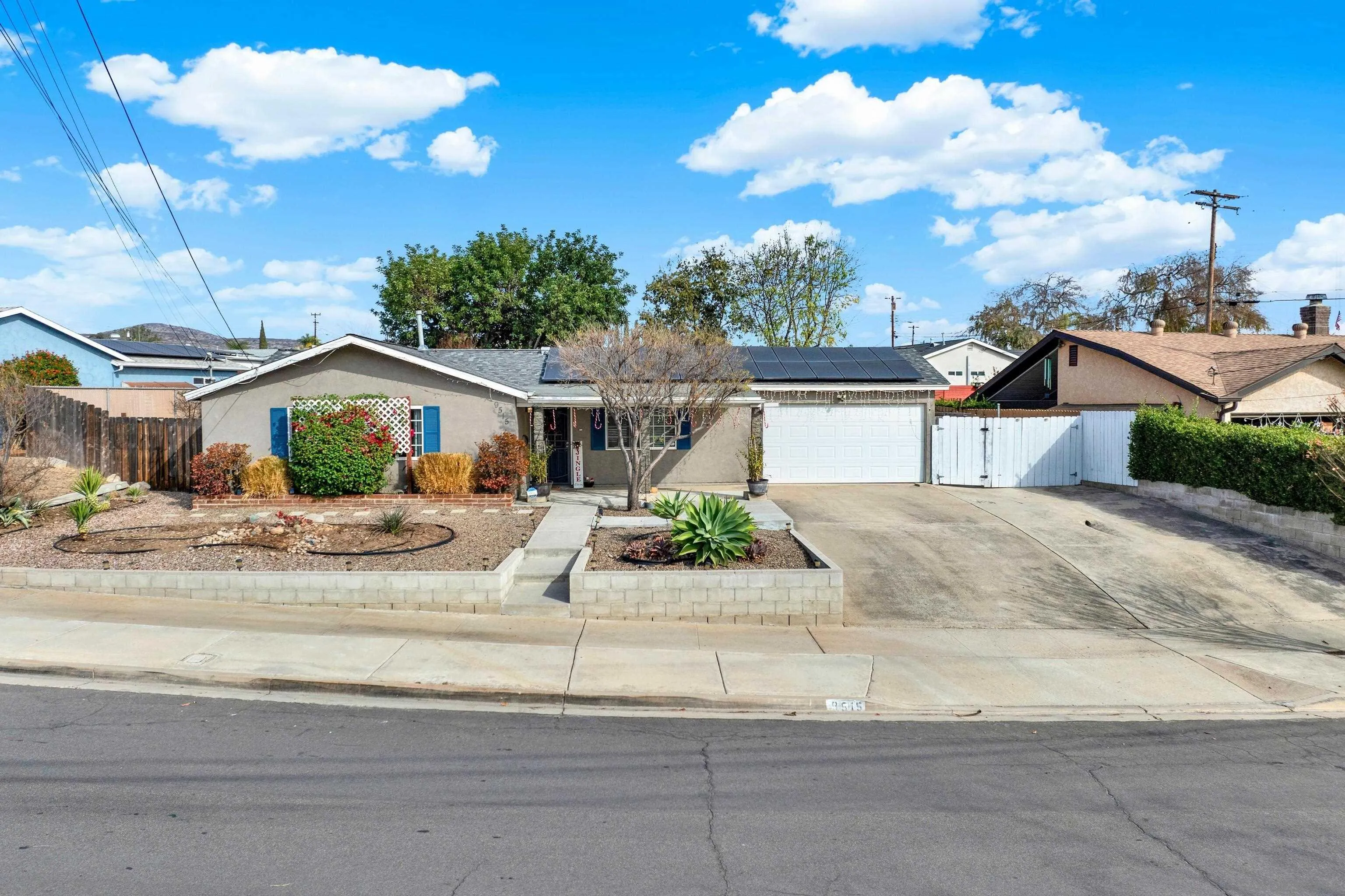 9515 Domer Road Santee, CA 92071 - Photo 1 of 45 a front view of a house with garden