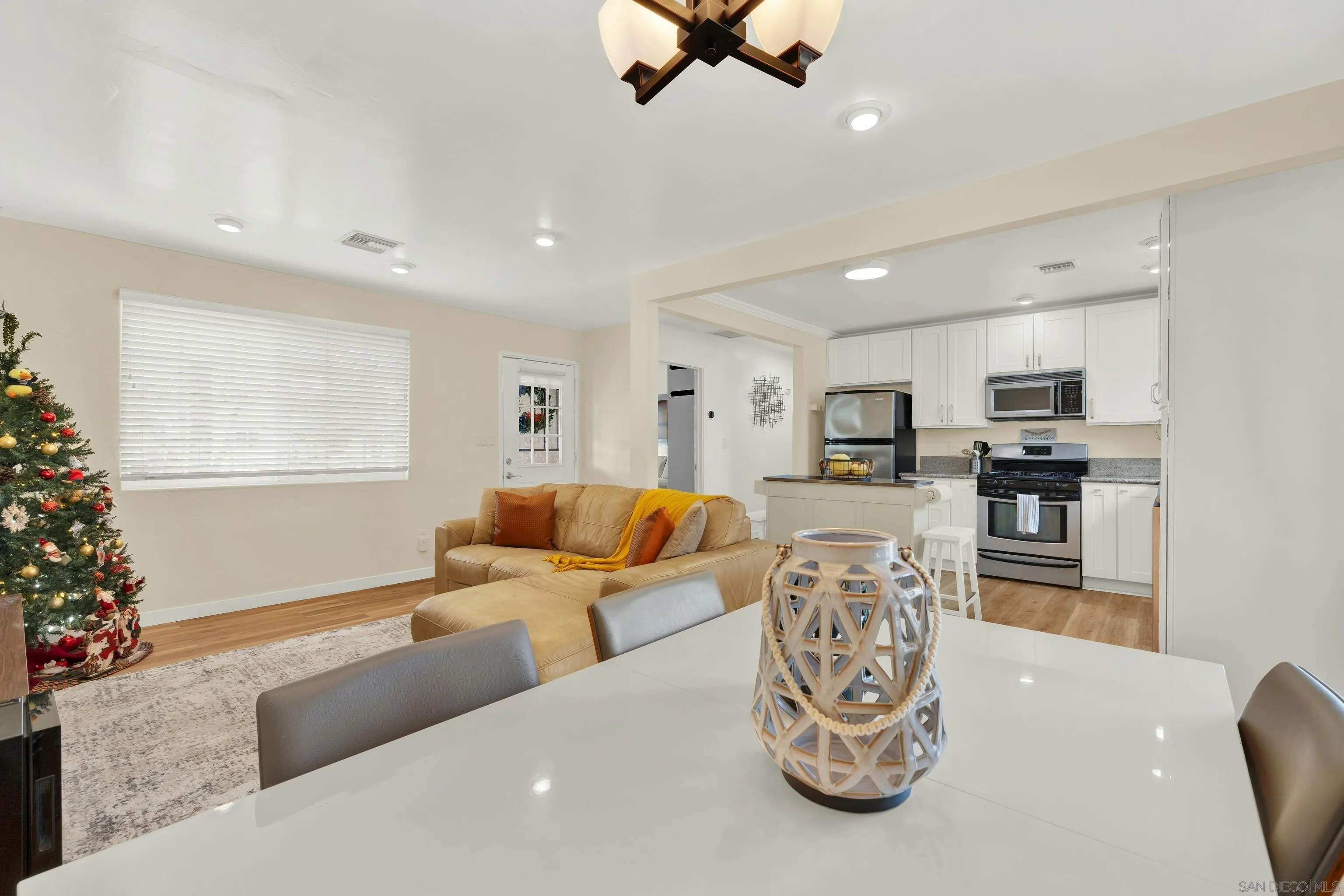 9515 Domer Road Santee, CA 92071 - Photo 15 of 45 a living room with furniture kitchen view and a potted plant