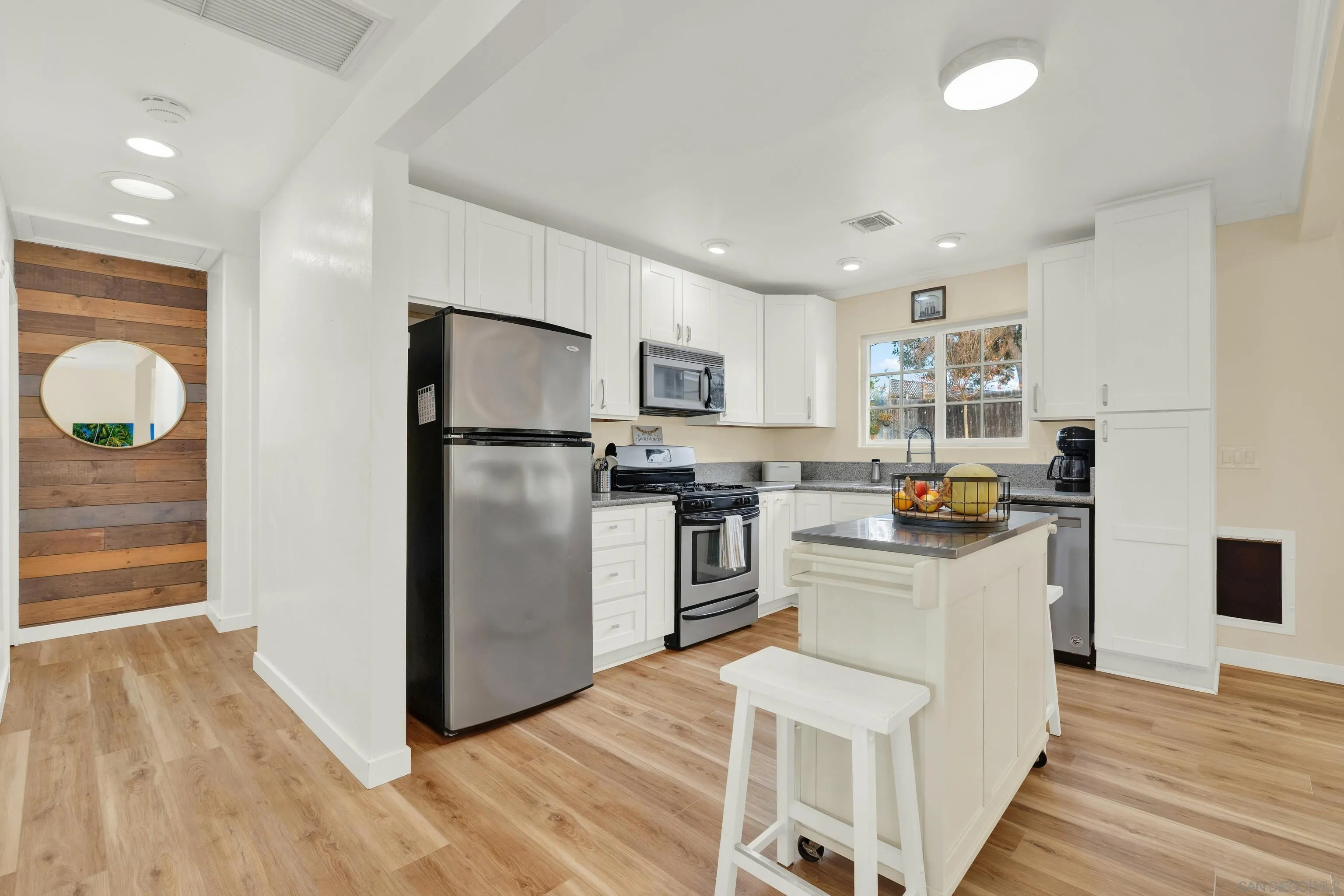 9515 Domer Road Santee, CA 92071 - Photo 20 of 45 a kitchen with stainless steel appliances granite countertop a refrigerator a stove top oven a sink and dishwasher
