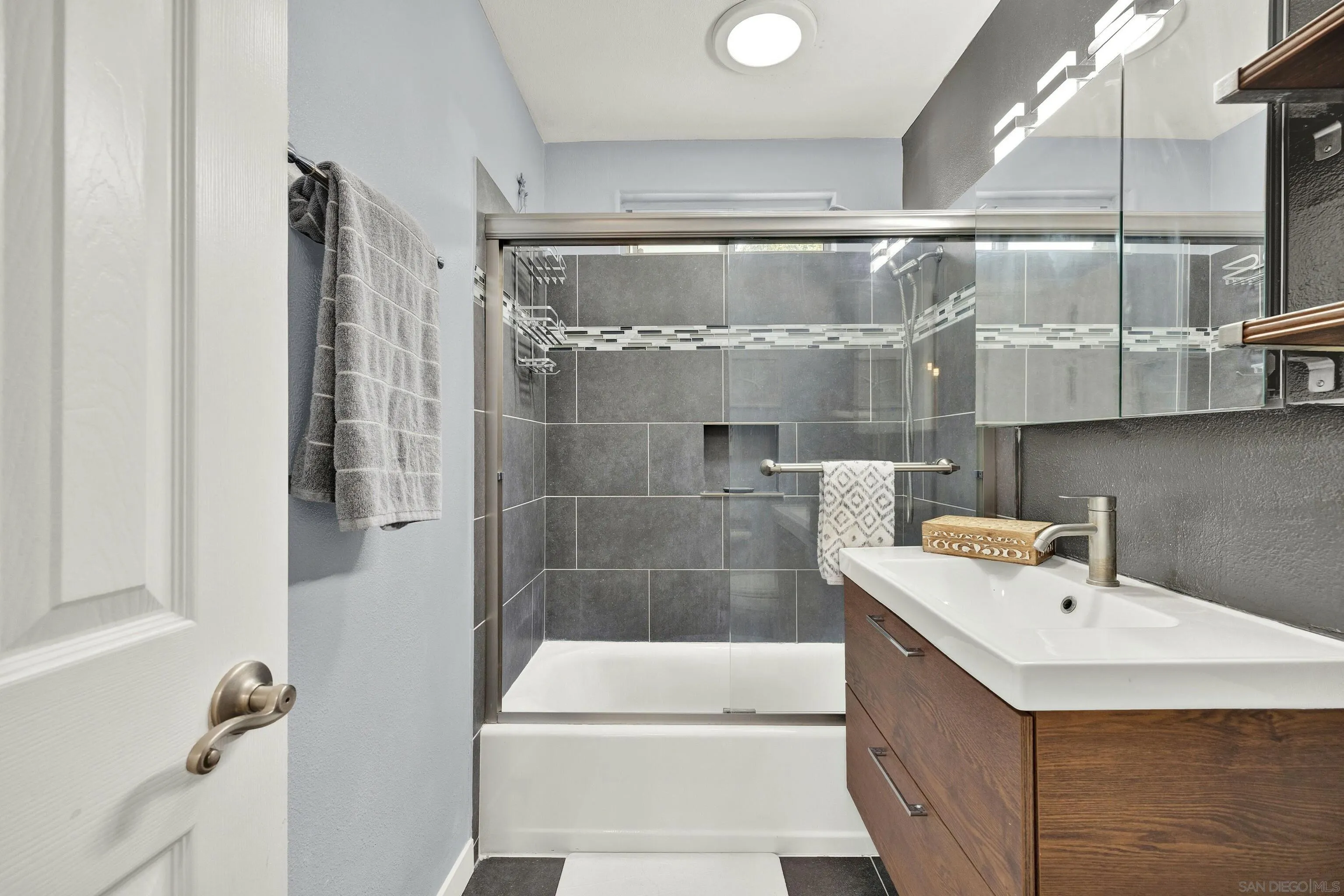 9515 Domer Road Santee, CA 92071 - Photo 25 of 45 a bathroom with a sink and mirror