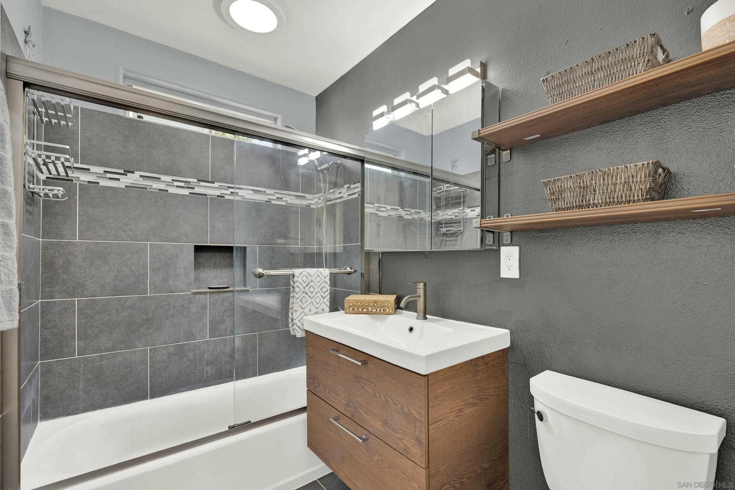 9515 Domer Road Santee, CA 92071 - Photo 26 of 45 a bathroom with a sink a toilet and shower