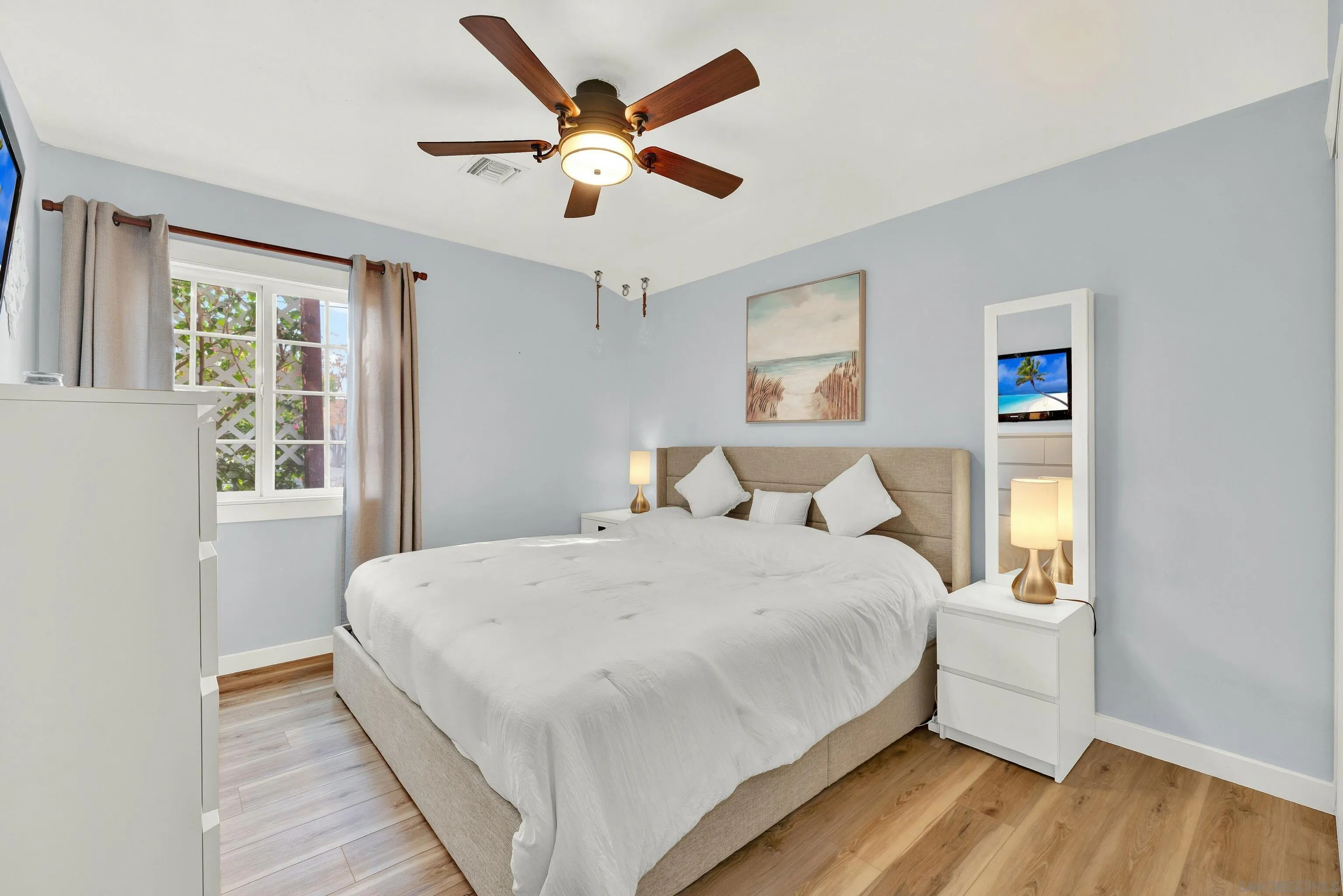 9515 Domer Road Santee, CA 92071 - Photo 29 of 45 a large bedroom with a bed and a large window