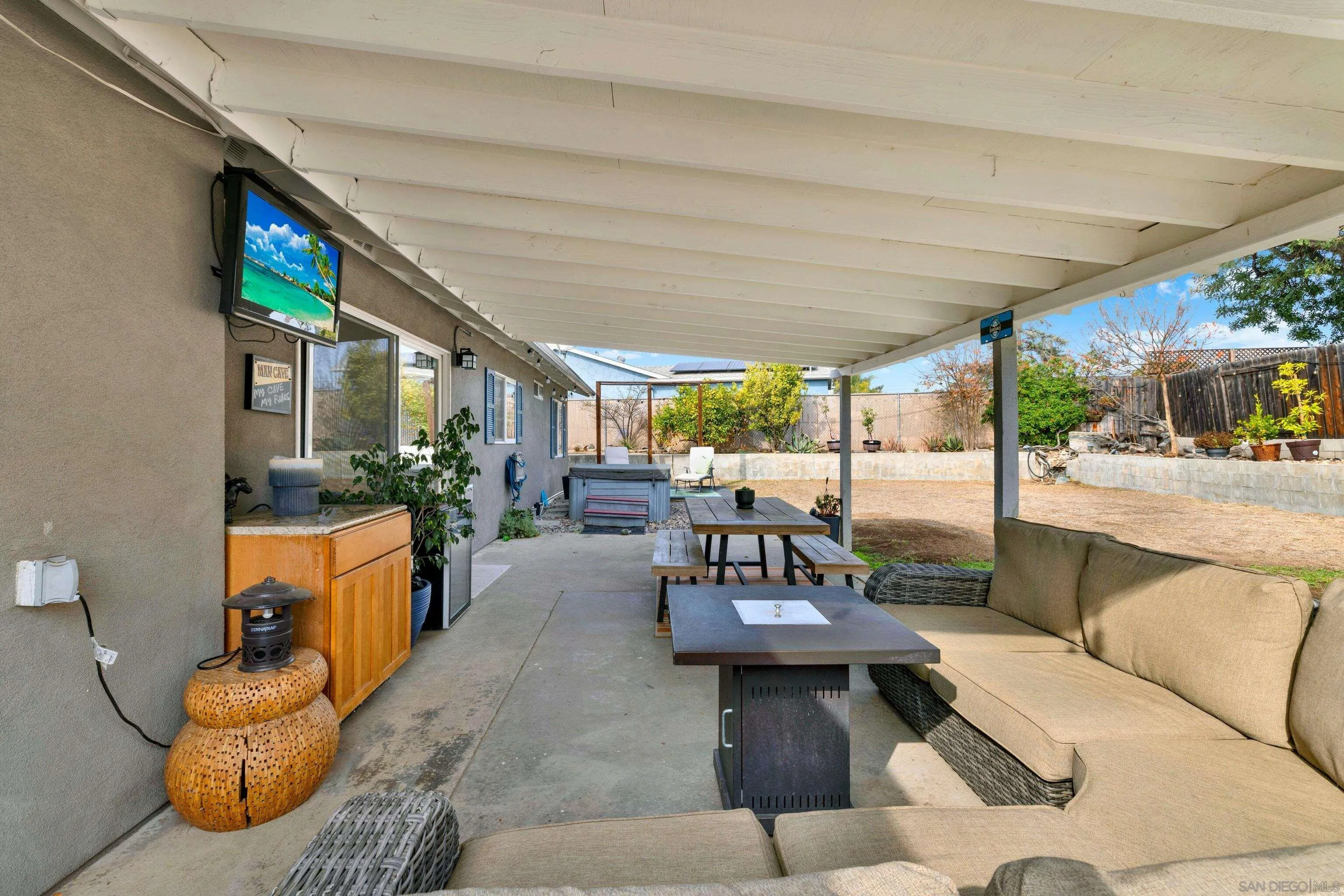 9515 Domer Road Santee, CA 92071 - Photo 40 of 45 a living room with furniture and a floor to ceiling window