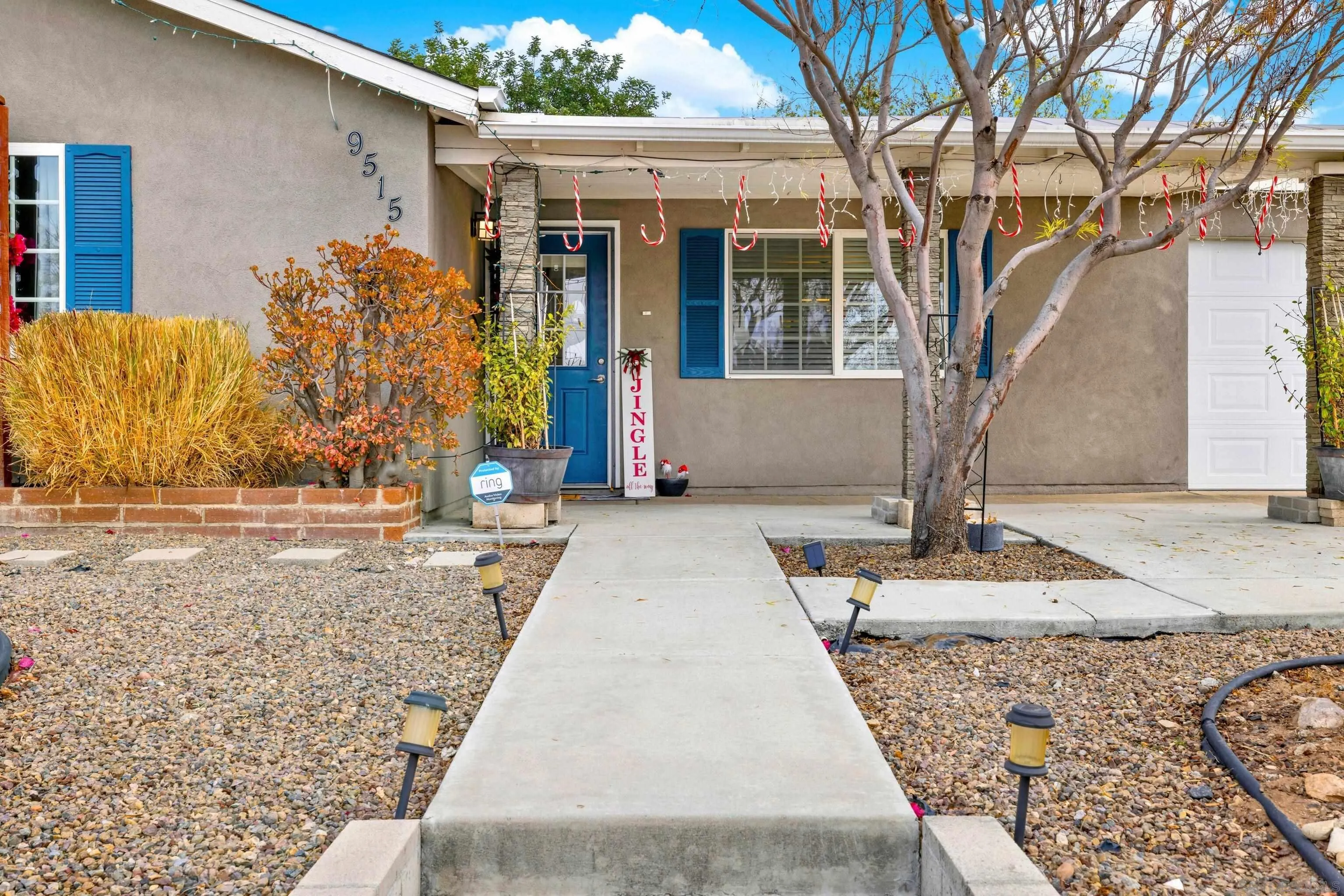 9515 Domer Road Santee, CA 92071 - Photo 4 of 45 a front view of a house with a yard