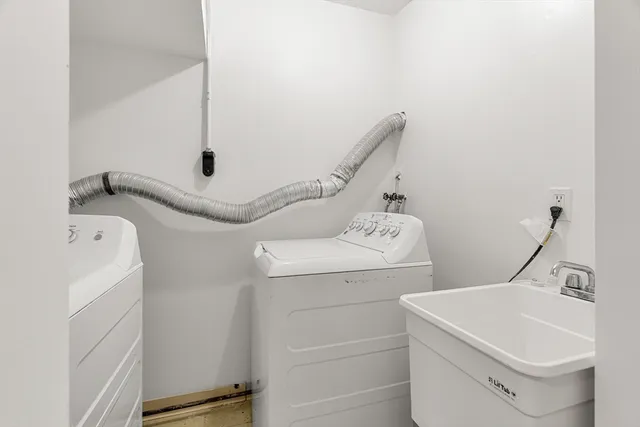 a bathroom with a sink toilet and tub