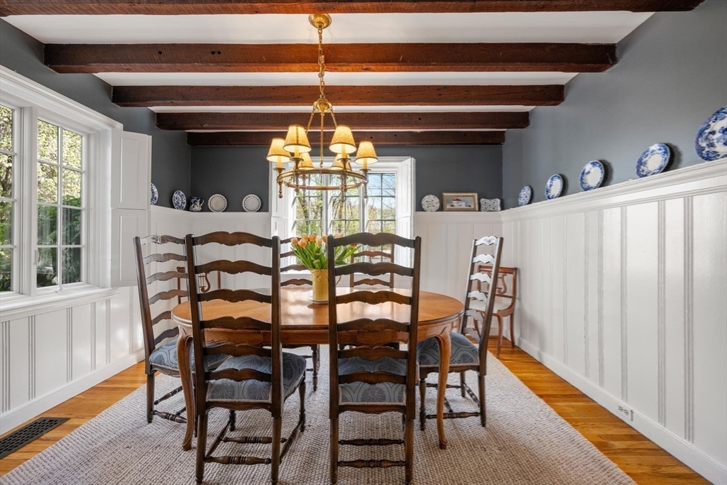 286 Quinobequin Road Newton, MA 02468 - Photo 5 of 31 a view of a dining room with furniture and chandelier