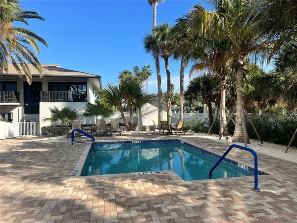 a view of swimming pool with chairs