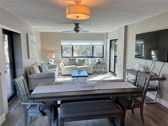 a view of a dining room with furniture window and outside view