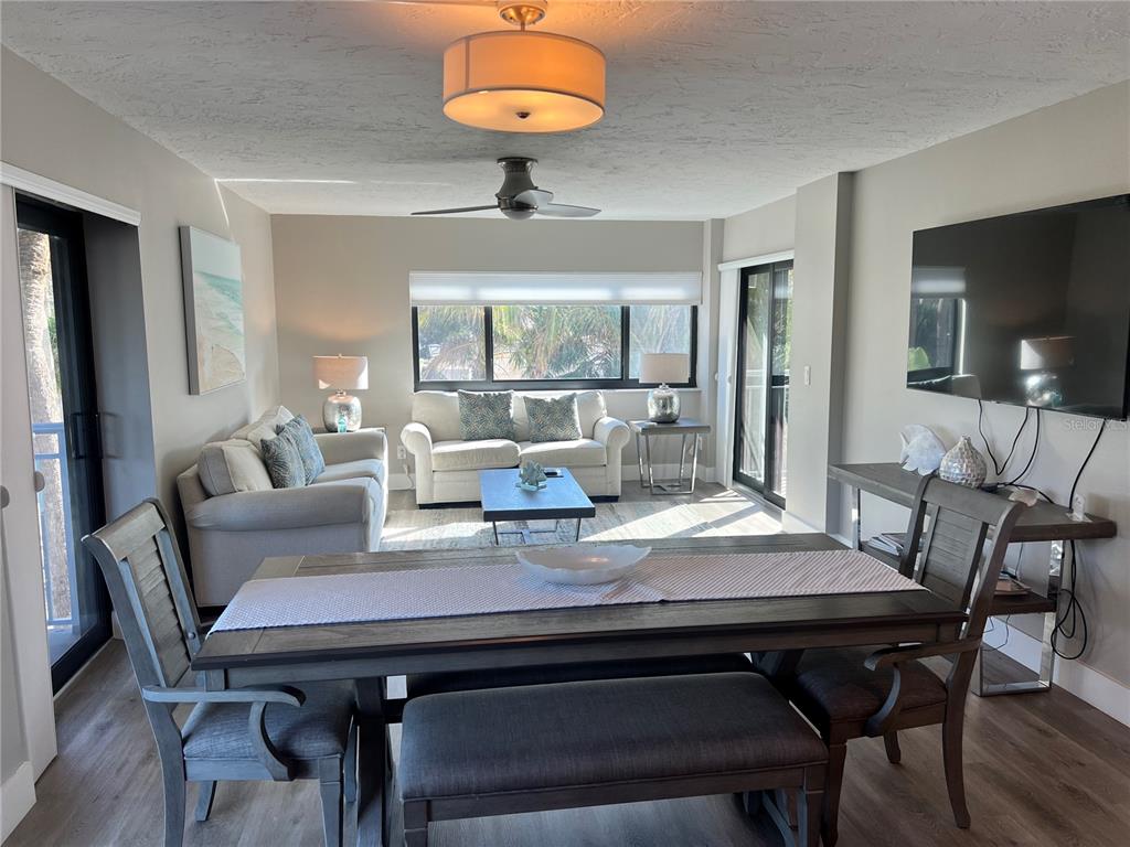 1001 Point Of Rocks Road, Unit 208 Sarasota, FL 34242 - Photo 2 of 33 a view of a dining room with furniture window and outside view