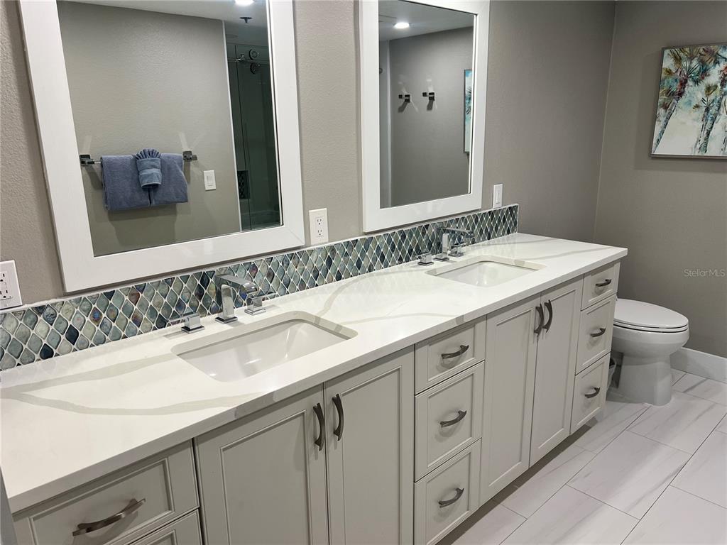1001 Point Of Rocks Road, Unit 208 Sarasota, FL 34242 - Photo 10 of 33 a bathroom with a sink and a toilet