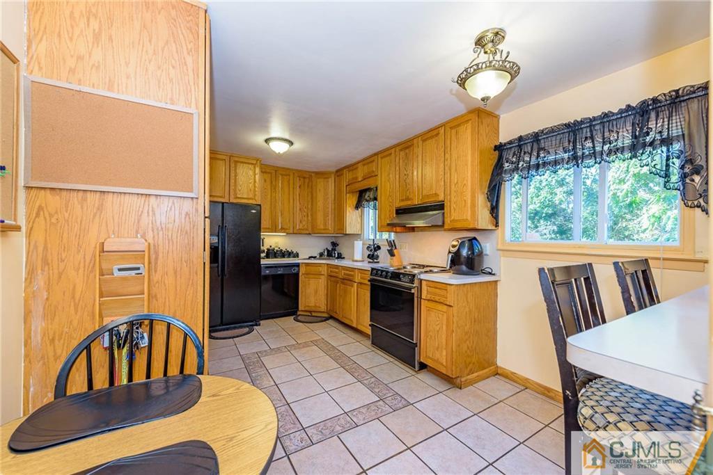 14 Gifford Road Somerset, NJ 08873 - Photo 11 of 25 a kitchen with stainless steel appliances granite countertop a refrigerator a sink a stove and island