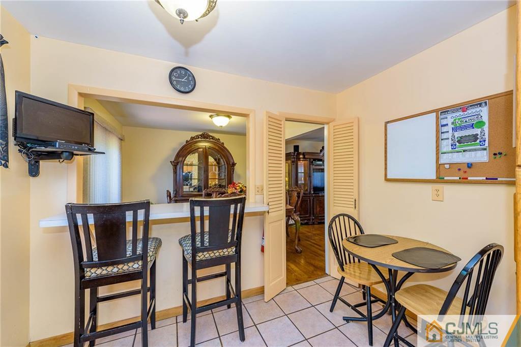 14 Gifford Road Somerset, NJ 08873 - Photo 13 of 25 a view of a dining room with furniture and a window