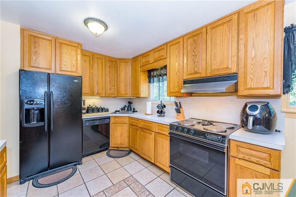 14 Gifford Road Somerset, NJ 08873 - Photo 14 of 25 a kitchen with stainless steel appliances granite countertop a stove a sink dishwasher and a refrigerator
