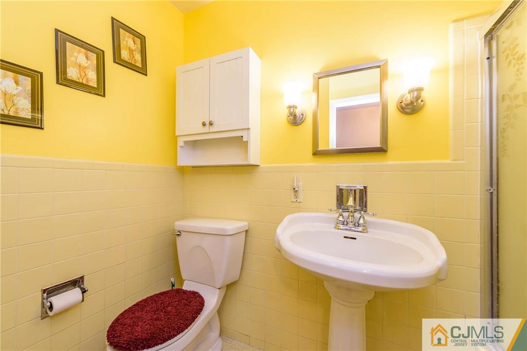 14 Gifford Road Somerset, NJ 08873 - Photo 15 of 25 a bathroom with a sink and a toilet