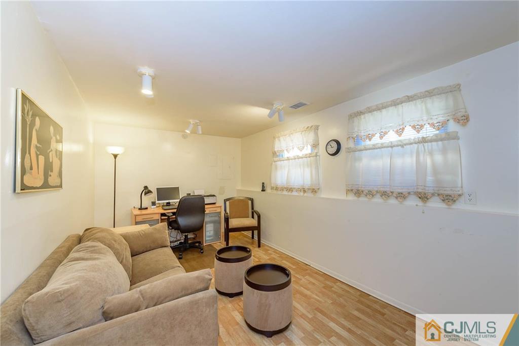 14 Gifford Road Somerset, NJ 08873 - Photo 3 of 25 a living room with furniture and a wooden floor