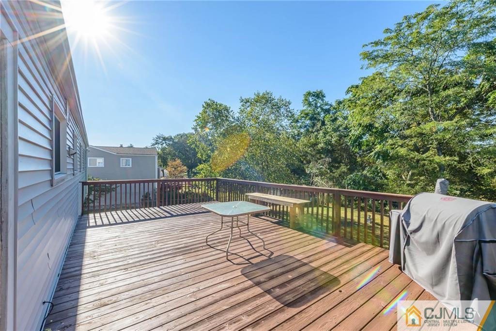14 Gifford Road Somerset, NJ 08873 - Photo 22 of 25 a view of balcony with wooden floor and fence