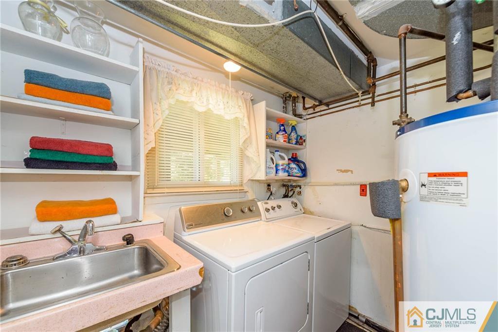 14 Gifford Road Somerset, NJ 08873 - Photo 5 of 25 a utility room with dryer and washer