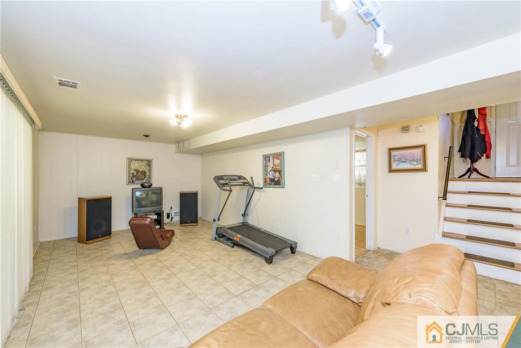 14 Gifford Road Somerset, NJ 08873 - Photo 6 of 25 a view of a bedroom with gym equipment