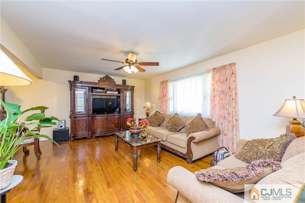 14 Gifford Road Somerset, NJ 08873 - Photo 7 of 25 a living room with furniture and a flat screen tv