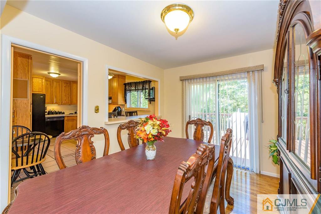 14 Gifford Road Somerset, NJ 08873 - Photo 9 of 25 a view of a dining room with furniture and a chandelier