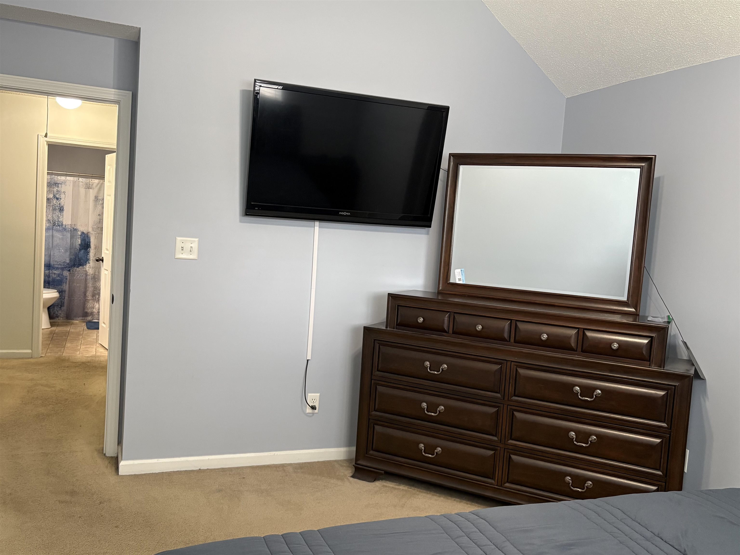 4356 Cedar Hills Road Memphis, TN 38135 - Photo 18 of 29 Carpeted room with a vaulted ceiling and light gray walls