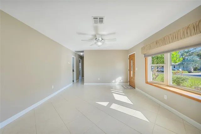 a view of an empty room with a window